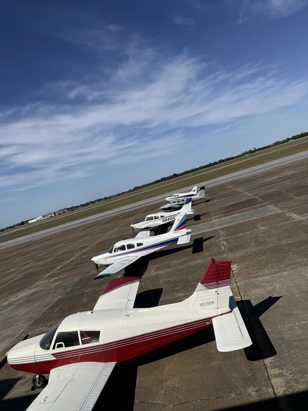 Three Pipers lined up on the ramp at golden hour at Ozark-Blackwell Airport (71J)