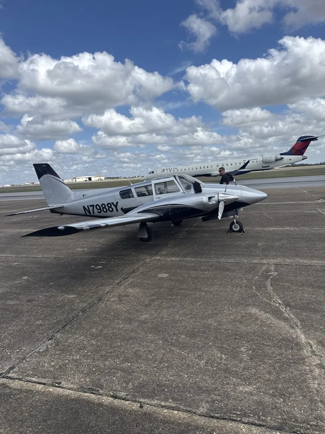 Two Pipers parked on the ramp with N7986Y Twin Comanche in the foreground at 71J