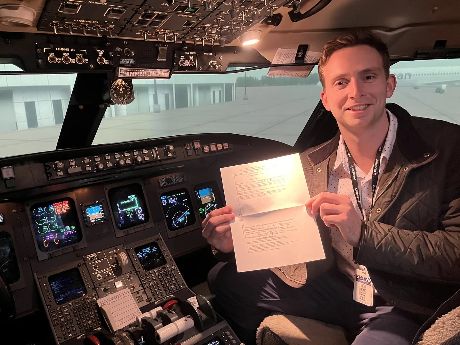 ACOM Aviation student with a Piper Cherokee after passing a checkride